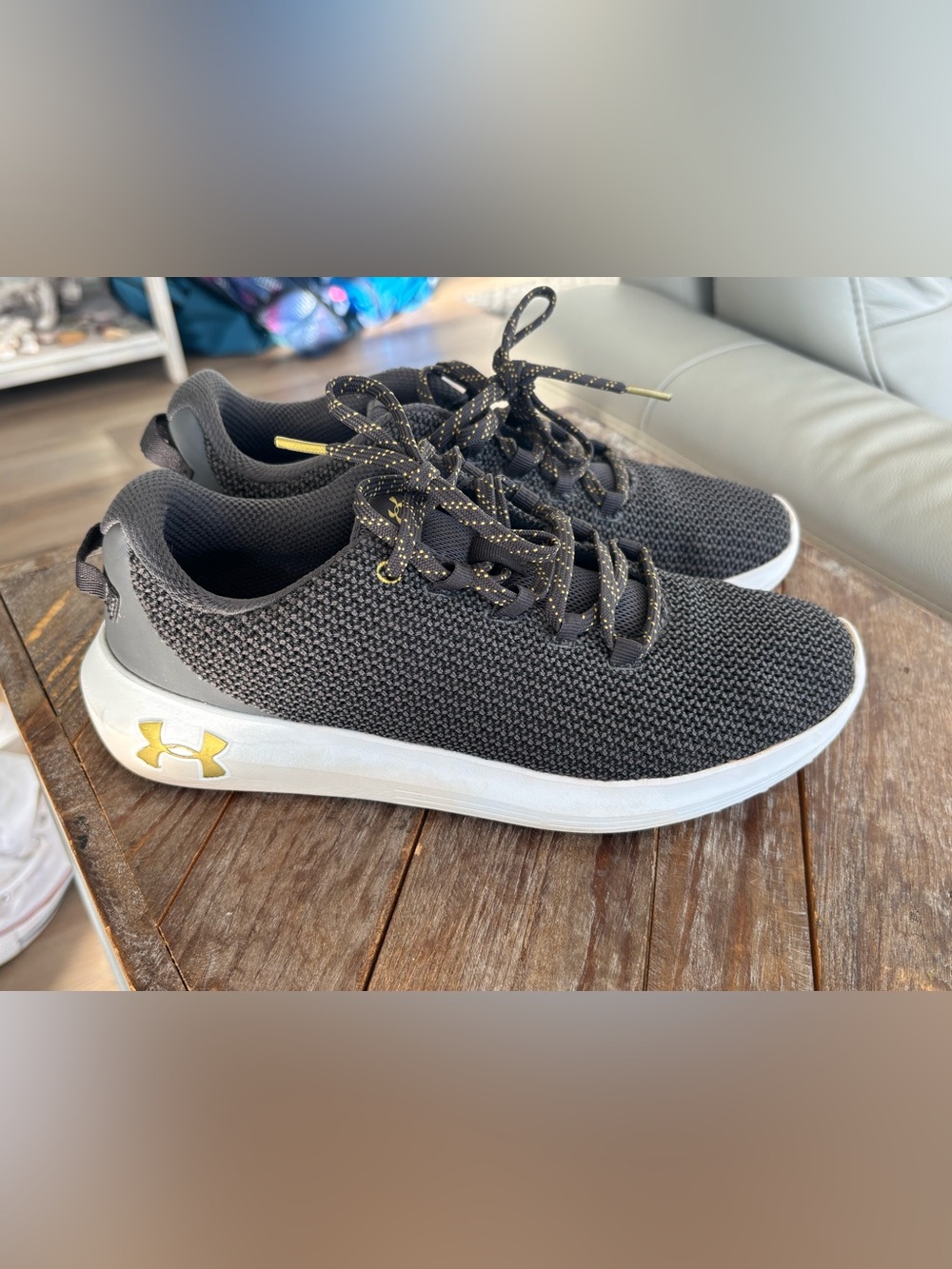 Under Armour Black Knit Sneakers with Gold Detailing